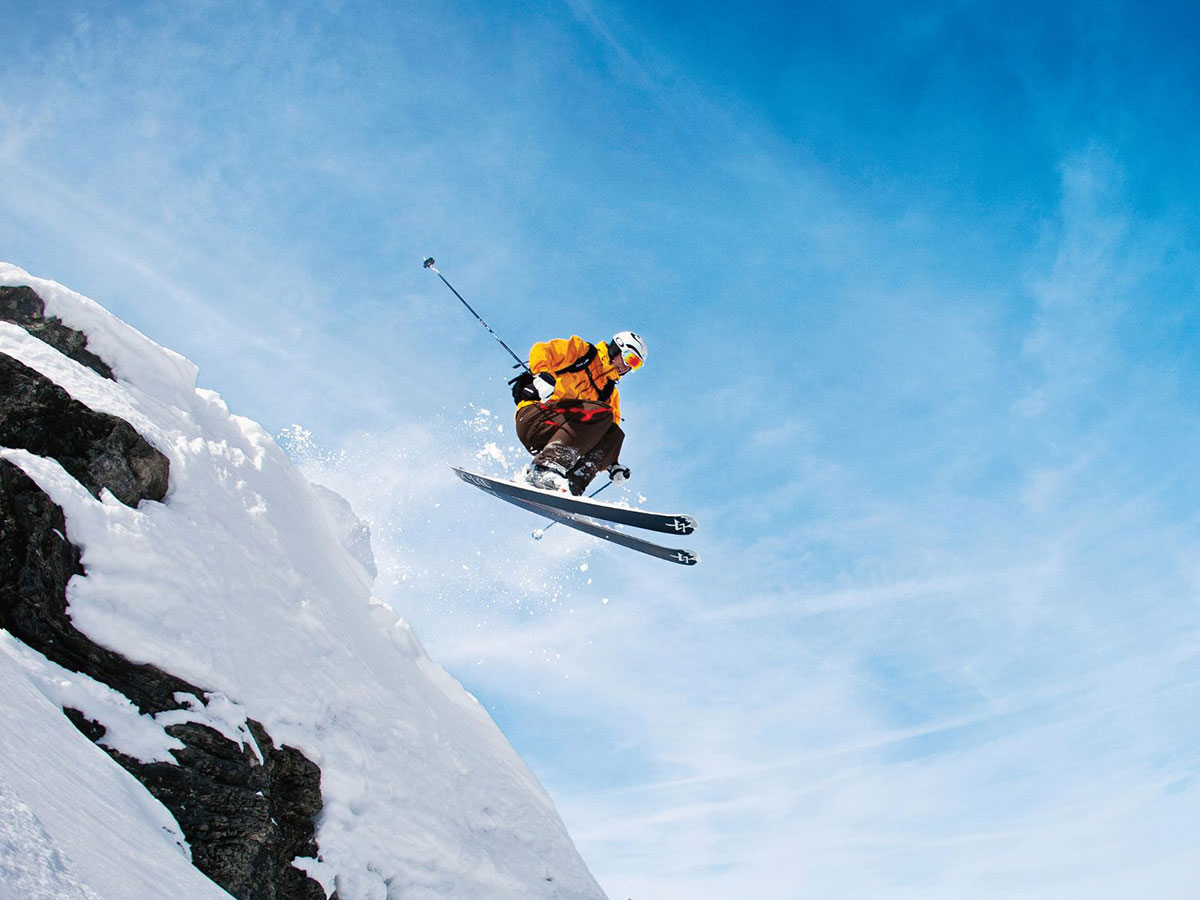 Skier in mid air on a mountain
