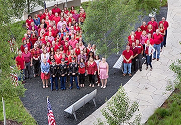 Arial photo of Athene employees wearing red shirts on Red Shirt Friday to show support of servicemen and women